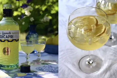 En flaska Limoncello Di Capri står bredvid två glas med drinken. Två glas med is och citroner fyller högra sidan. En perfekt limoncello spritz för en solig dag.