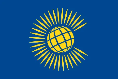 Bandera azul con un globo terráqueo amarillo rodeado de rayos amarillos, representando el Commonwealth.