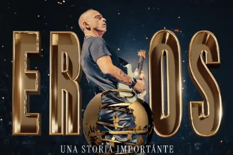 Eros Ramazzotti mit Gitarre, umgeben von goldenen Buchstaben und einer Weltkugel. Ankündigung der Eros Ramazzotti Tour 2026.