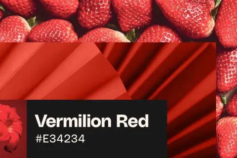 Juicy strawberries and a vibrant vermilion red flower, showcasing the rich hue.