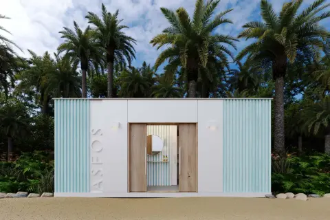 Diseño moderno para saber como hacer un baño exterior, con palmeras y arena.
