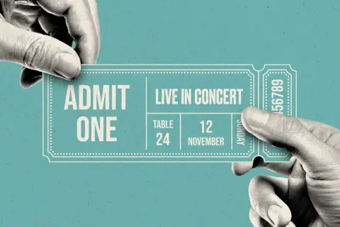 Hands exchange a concert ticket. A resale ticket means someone is selling their ticket to another person, often at a different price.