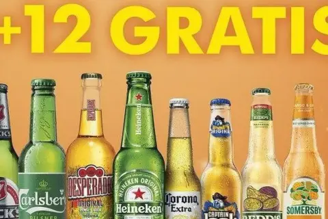 Rząd butelek piwa różnych marek, w tym Carlsberg, Desperados, Heineken, Corona, Captain Jack, Redd's i Somersby.