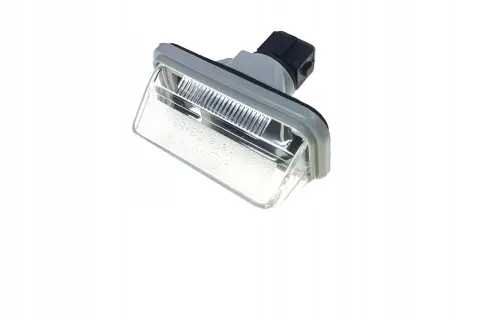 Lampa oświetlenia tablicy rejestracyjnej do Toyota Avensis T25. Gotowa do wymiany, by tablica była zawsze widoczna.