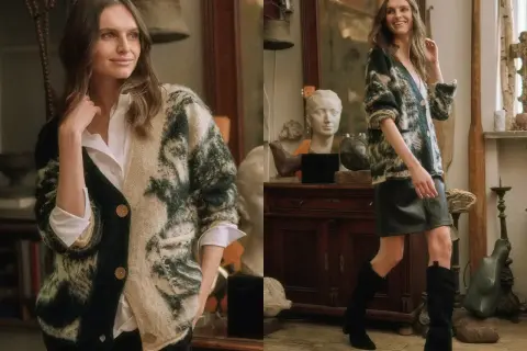 Kobieta w swetrze z wzorem tie-dye, pokazująca, jak zapiąć sweter. Stylizacja z białą koszulą i czarną spódniczką.