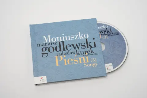 Płyta CD z nagraniem "Pieśni" Moniuszki w wykonaniu Mariusza Godlewskiego i Radosława Kurka. Prząśniczka tekst na okładce.