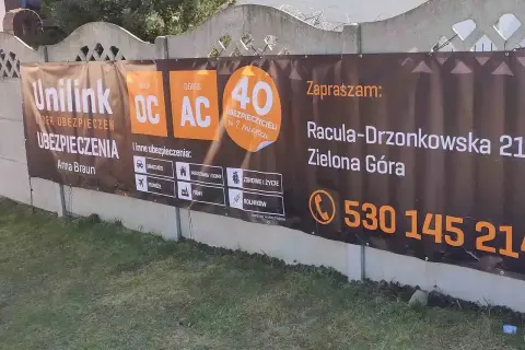 Baner reklamowy agencji ubezpieczeniowej Unilink w Zielonej Górze z informacjami o ofercie i kontaktem.