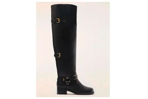 Stivali cuissard neri con fibbie dorate. Perfetti per slanciare la figura e completare look audaci.