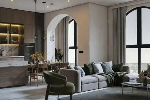 Soggiorno e cucina open space con tavolo da pranzo e divano, in un elegante stile essenziale.