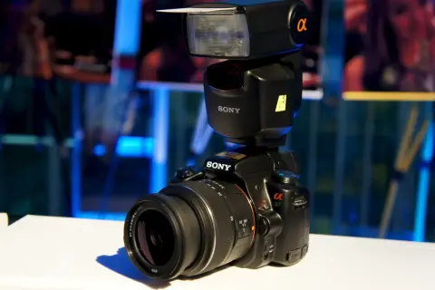 A Sony a37 camera with a flash unit attached, ready to capture any moment.