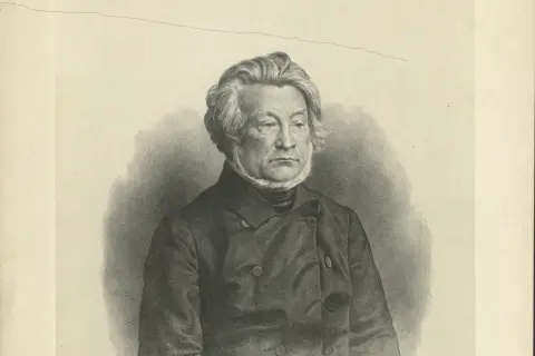 Portret mężczyzny w stroju z epoki, z bujnymi włosami i bokobrodami, w ciemnej marynarce.