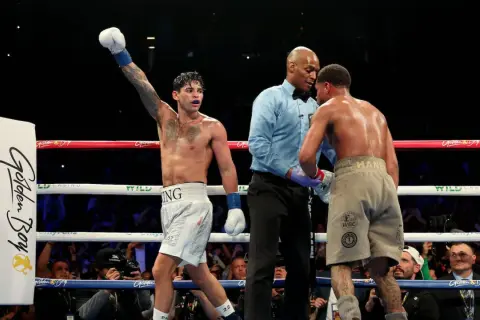 Boxer with arm raised, referee between two fighters. A majority decision in boxing means two of the three judges scored the fight for one boxer.