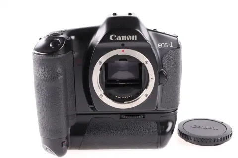 Czarny Canon EOS-1, klasyk wśród aparatów analogowych, gotowy do uchwycenia niezapomnianych chwil.