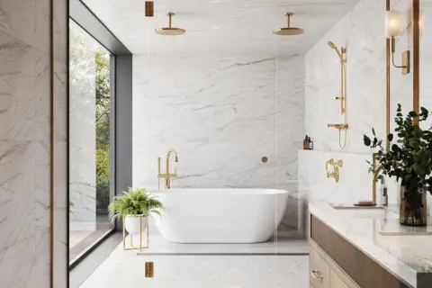 Luxurious bathroom with white marble ceramic tile on shower walls, a freestanding tub, and gold fixtures.