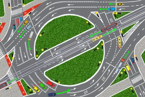 Ilustracja pokazuje skrzyżowanie o ruchu okrężnym z samochodami, tramwajem i rowerzystami. Zgodnie z kodeksem drogowym, pojazdy poruszają się po rondzie zgodnie z zielonymi strzałkami.