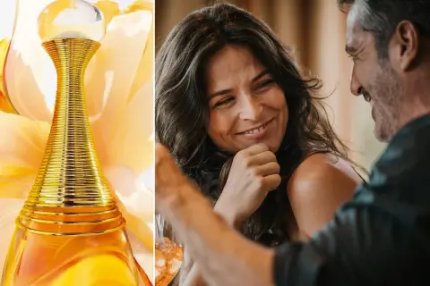 Złota butelka Dior J'adore 100ml obok uśmiechniętej pary.