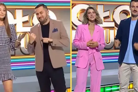 Iza Krzan w Kole Fortuny w różowym garniturze, obok niej prowadzący w eleganckich strojach.