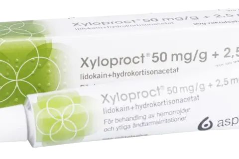 Xyloproct salva mot hemorrojder. Förpackning och tub med salva för behandling av hemorrojder och ändtarmsirritationer.