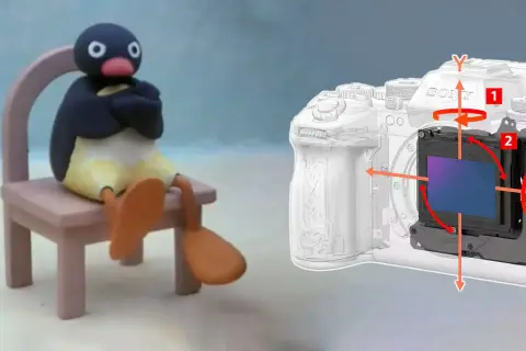 Pingu siedzi na krześle, obok schemat aparatu z zaznaczonym systemem stabilizacji obrazu (ois).