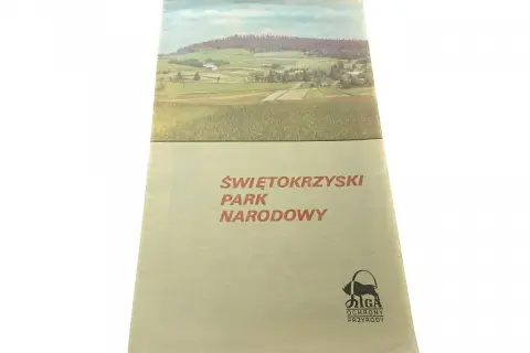 Okładka przewodnika po Świętokrzyskim Parku Narodowym z malowniczym krajobrazem i logo ochrony przyrody.