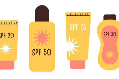 Cztery żółte opakowania kremów z filtrem: SPF 20, SPF 50, SPF 15 i SPF 30. Wybierz odpowiedni filtr do opalania dla swojej skóry.