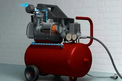 En röd kompressor med genomskuren motor som visar hur luften flödar, redo att måla med tryckluft.