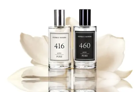 Dwa eleganckie flakony z polskimi perfumami Federico Mahora, 416 i 460, na tle delikatnych płatków kwiatów.