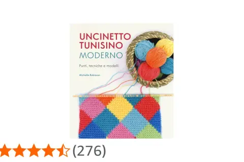 Uncinetto tunisino moderno: un libro con gomitoli colorati e un campione a rombi.