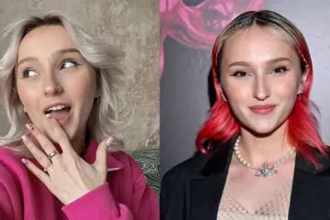 Hania z GenZie w różowej bluzie i z czerwonymi włosami, z uroczym makijażem i paznokciami.