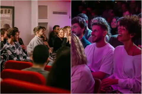Des spectateurs rient aux éclats dans un **comedy club Paris gratuit**. Ambiance chaleureuse et humour garanti.
