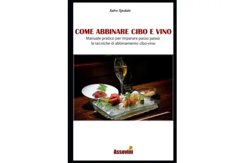 Copertina libro "Come abbinare cibo e vino". Un piatto di sashimi e tartare con una bottiglia e un calice di vino, per scoprire il perfetto abbinamento cibo vino.