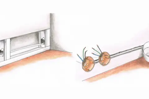 Instalacja elektryczna w ścianie z karton gipsu. Widoczne puszki instalacyjne z przewodami i za duży otwór pod puszkę w regipsie.