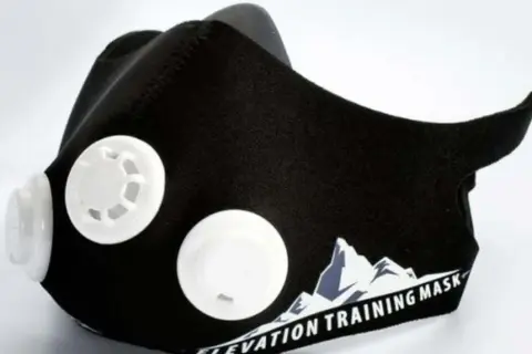 Black training mask with white valves, designed to enhance workout performance. Discover the training mask benefits for your fitness journey.