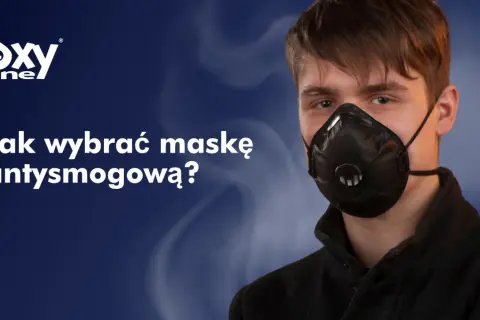 Młody mężczyzna w masce antysmogowej. Czy maska chroni przed smogiem? Logo Oxyline.