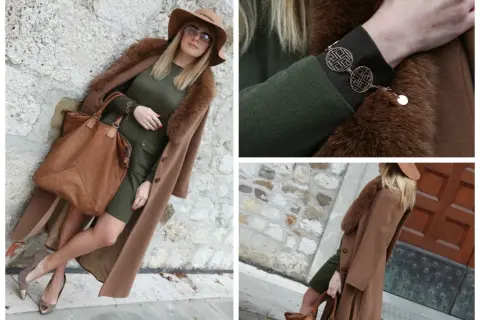 Eleganza in verde e cammello: un cappotto lungo, cappello e borsa in color cammello, abbinati a un vestito verde.