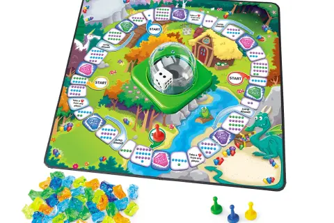 Tablero de juego infantil con dragón, unicornio y gemas de colores.