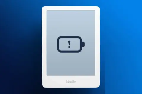 Écran de Kindle affichant une icône de batterie vide avec un point d'exclamation. Ma Kindle ne charge plus, c'est frustrant !