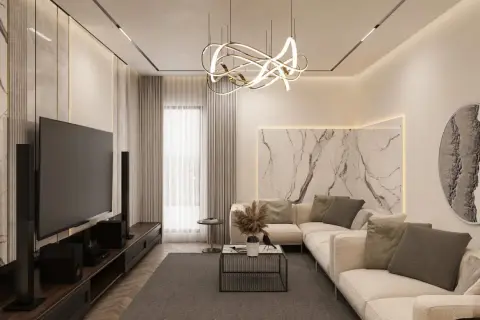 Nowoczesny salon z designerską lampą i subtelnym oświetleniem LED. Idealne, jakie oświetlenie do salonu, by stworzyć przytulną atmosferę.