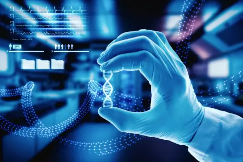 Rękawiczka laboratoryjna trzyma model DNA, symbolizując przełomowe esaliens medycyny i nowych technologii.