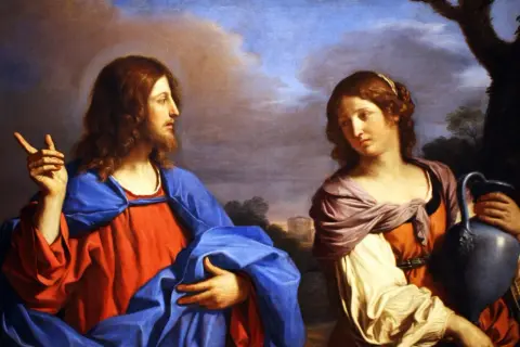 Jesus spricht zur heiligen Magdalena, die eine Kanne trägt.