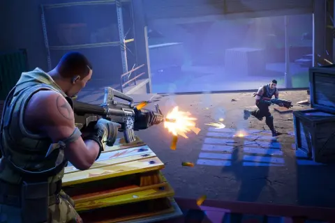 Dwóch graczy w grze battle royale, jeden strzela z karabinu, drugi biegnie.