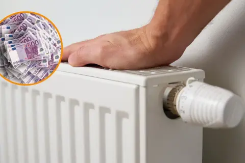 Un radiador blanco con un termostato y un círculo de billetes de 500 euros. Es bueno apagar la caldera por la noche para ahorrar dinero.
