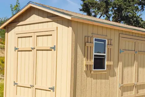 A newly built shed with double doors and a window. This shed is ready to build your dreams in.
