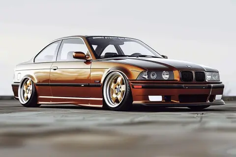 Złote felgi i brązowy lakier tego klasycznego e36 bmw podkreślają jego sportowy charakter.