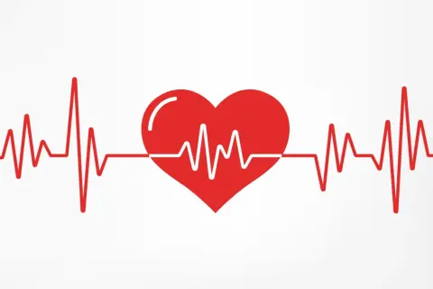 Czerwone serce z linią EKG na białym tle.