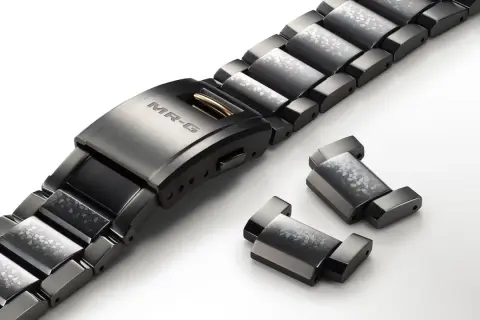 Brazalete de reloj MR-G con eslabones decorados y piezas sueltas, ideal para quitar eslabones reloj sin pasador.