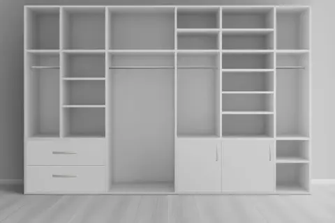 Un placard profond blanc avec étagères, penderies et tiroirs, idéal pour aménager un espace de rangement optimisé.