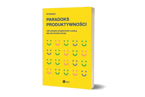 Okładka książki "Paradoks Produktywności" Ali Abdaala. Żółte tło z rzędami uśmiechniętych buziek.