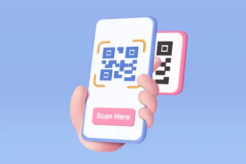 Dłoń trzyma smartfon z kodem QR i przyciskiem "Scan Here". Dowiedz się, jak zeskanować kod QR.