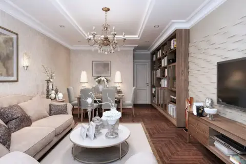 Elegancki salon z jadalnią, gdzie króluje styl w domu. Jasna sofa, kryształowy żyrandol i regał z książkami tworzą przytulną atmosferę.